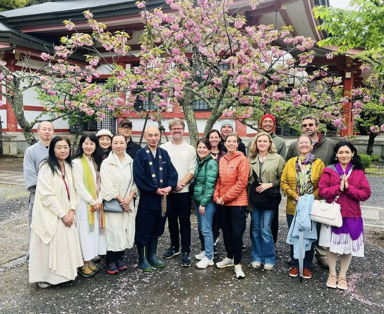 The head priest of Mt. Kurama with Bruce Taylor and the 2024 Deep Roots tour group
